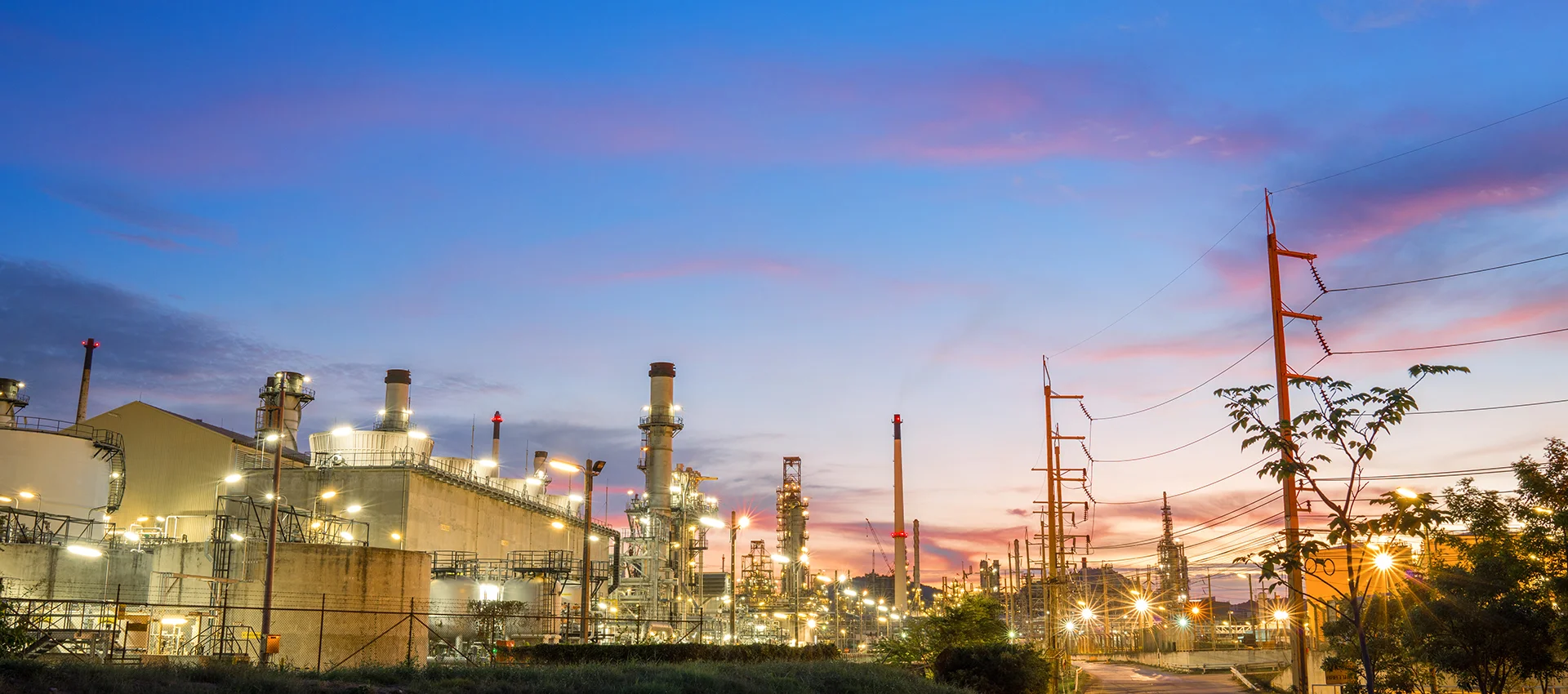 Oil Refinery Plant at sunset. Gas Chemical Equipment Prodiction